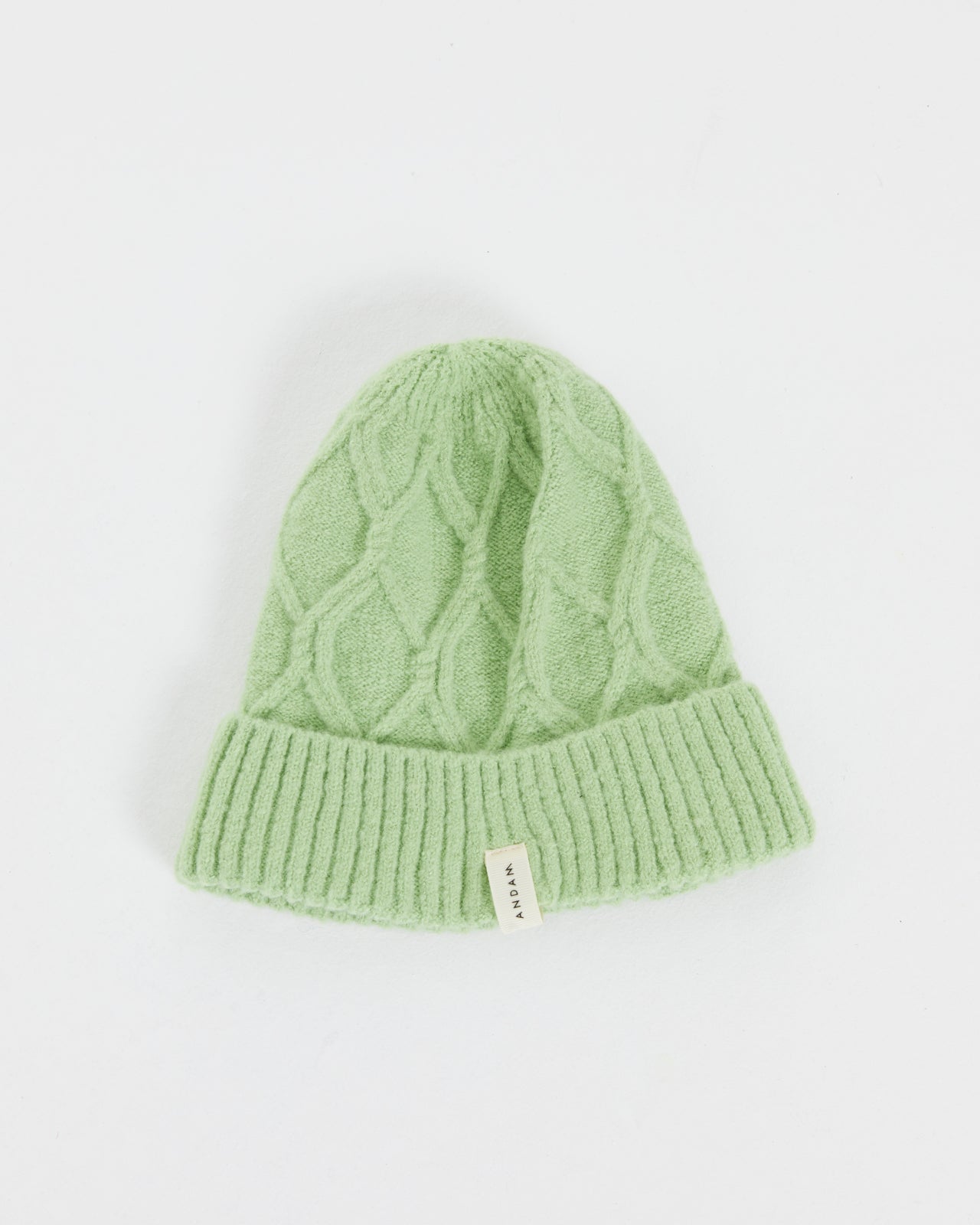 Women's knitted hat with braided structure
