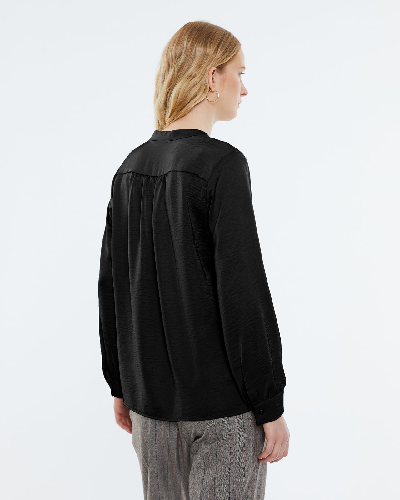 Women's satin blouse with long sleeves, mandarin collar and V-neckline.