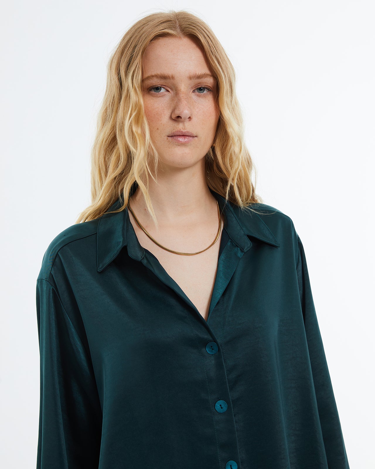 Women's satin shirt with long sleeves and shirt collar.