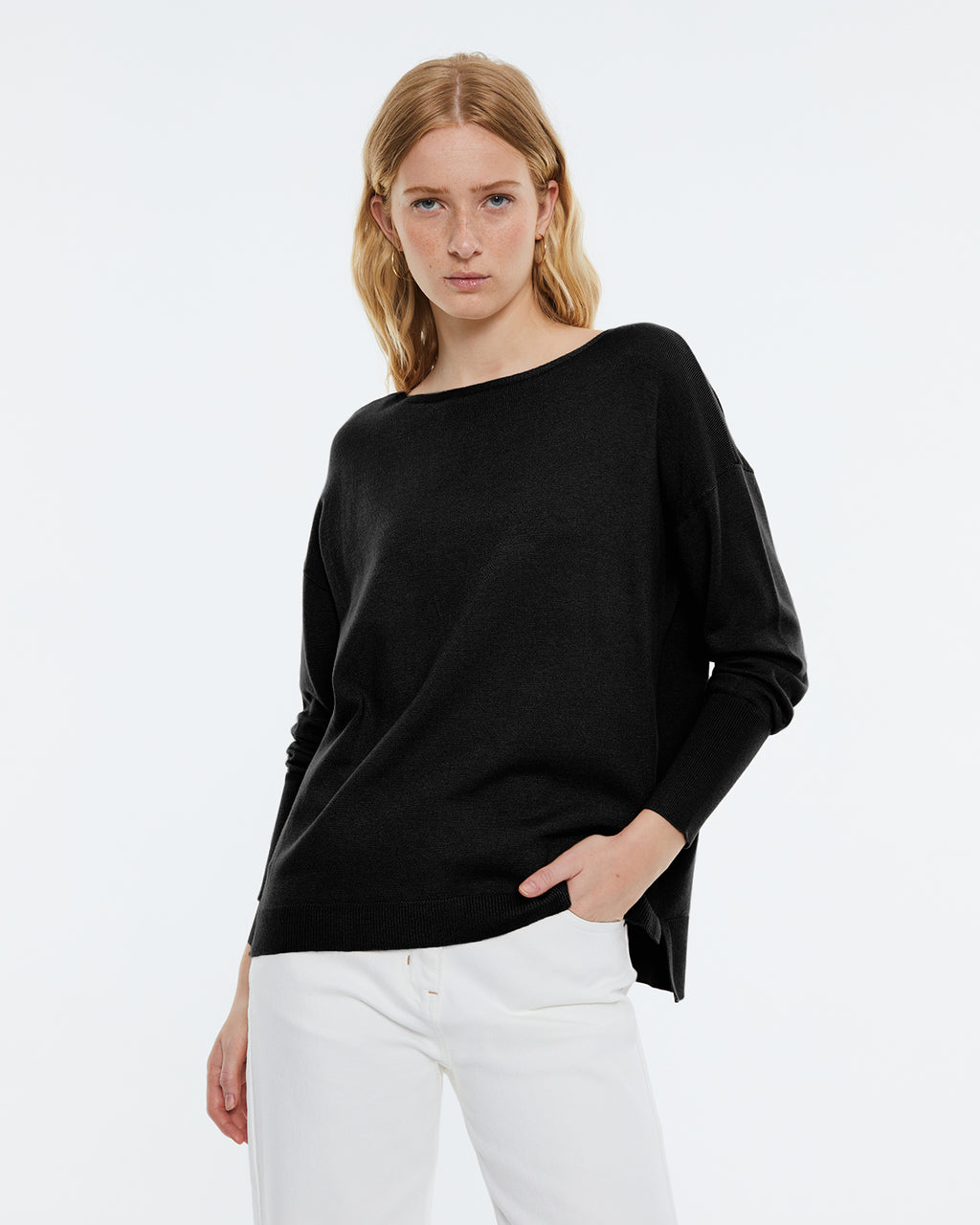 Women's boat neckline, long sleeve sweater.