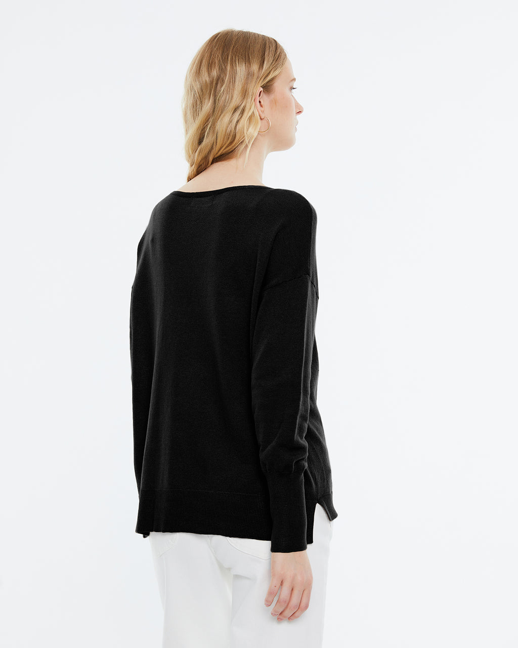 Women's boat neckline, long sleeve sweater.