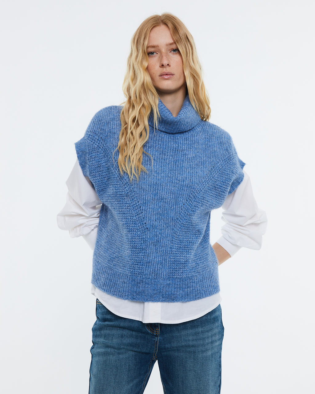 Women's knitted vest with high neck.