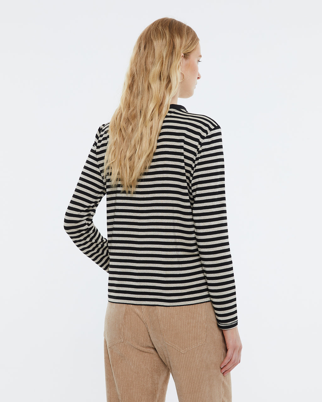 Women's striped print t-shirt with round neckline and long sleeves.