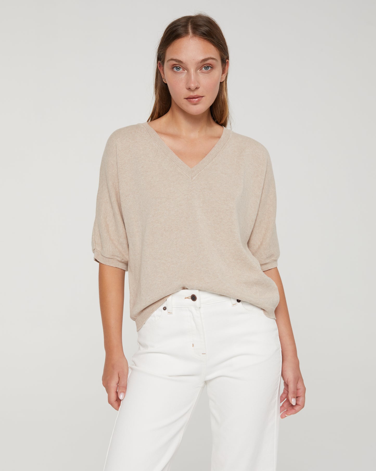 Women's V-neck, short-sleeved sweater.