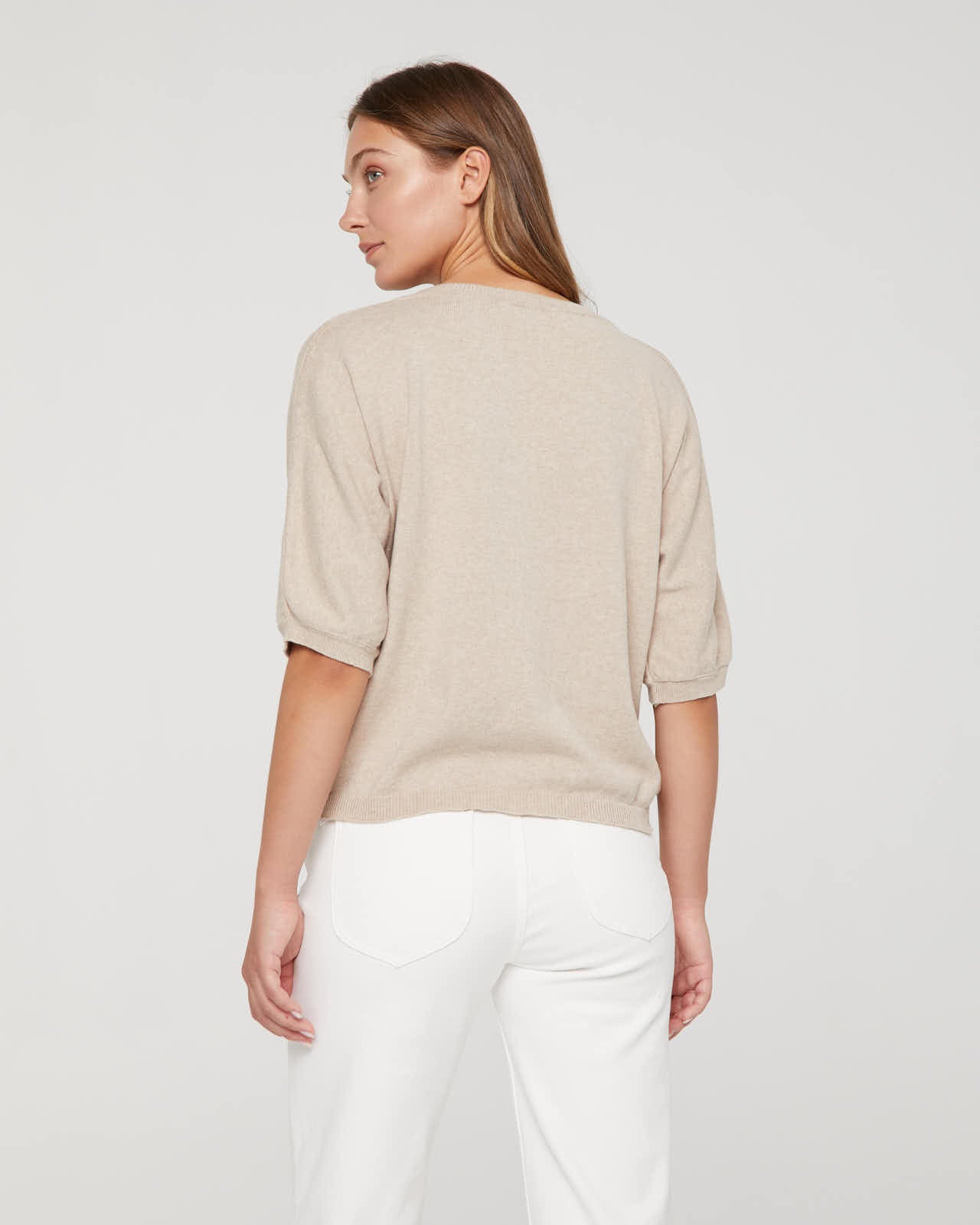 Women's V-neck, short-sleeved sweater.