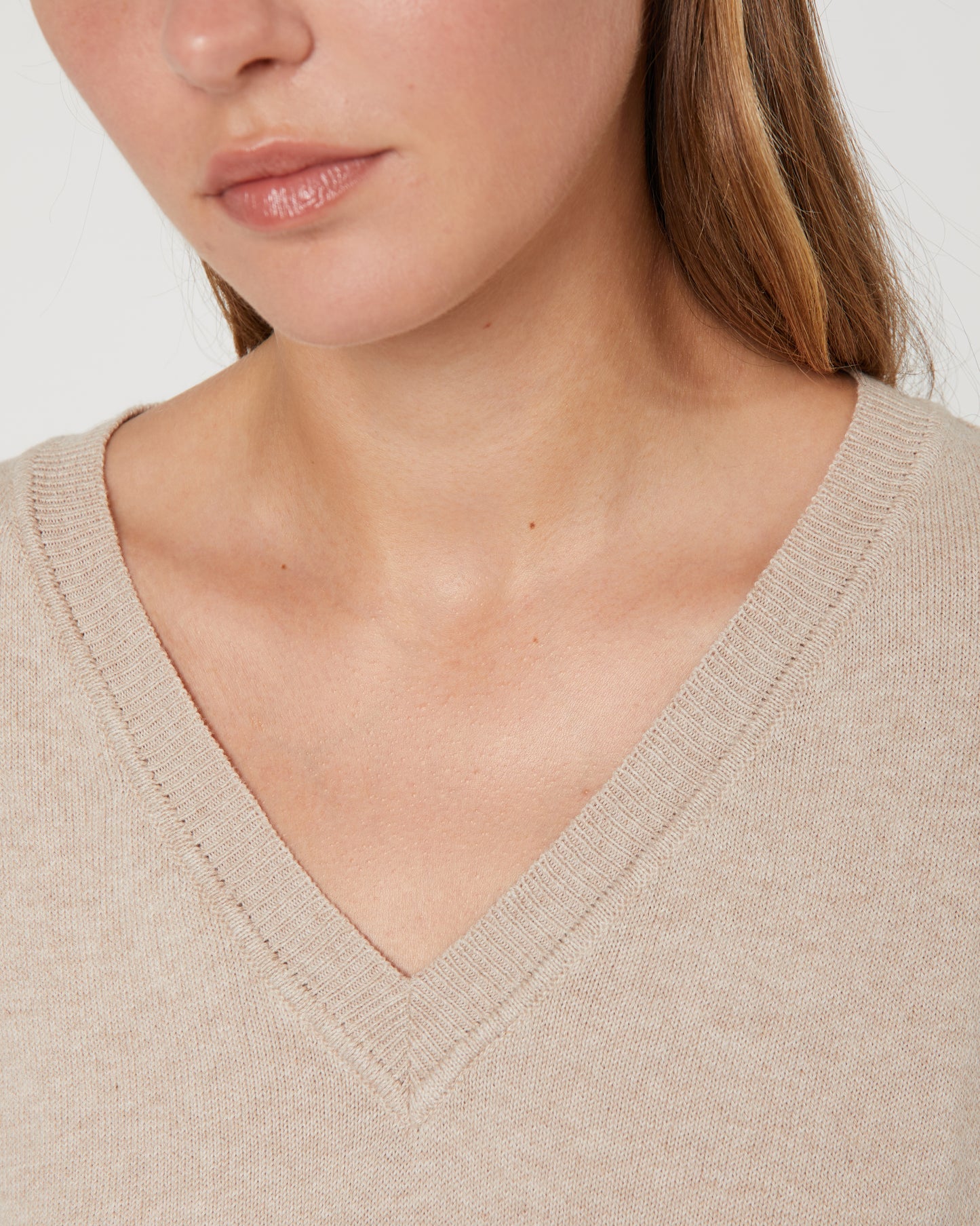 Women's V-neck, short-sleeved sweater.