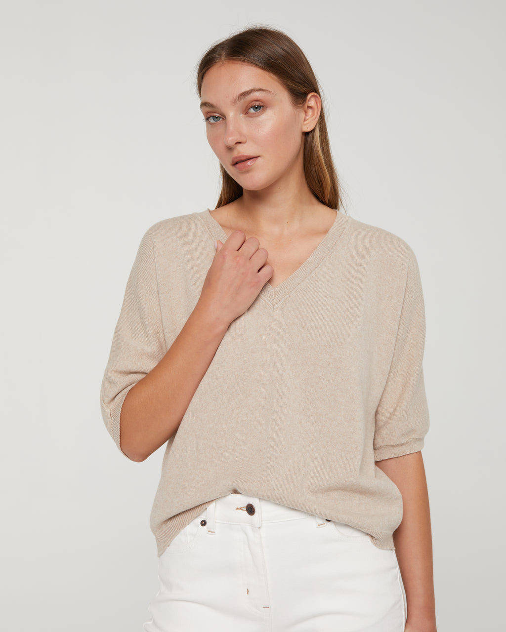 Women's V-neck, short-sleeved sweater.