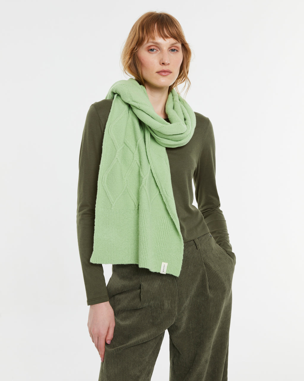 Knitted scarf with braided structure