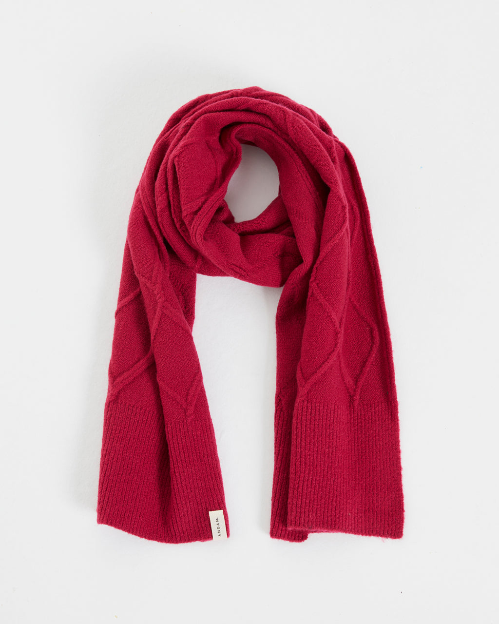 Knitted scarf with braided structure