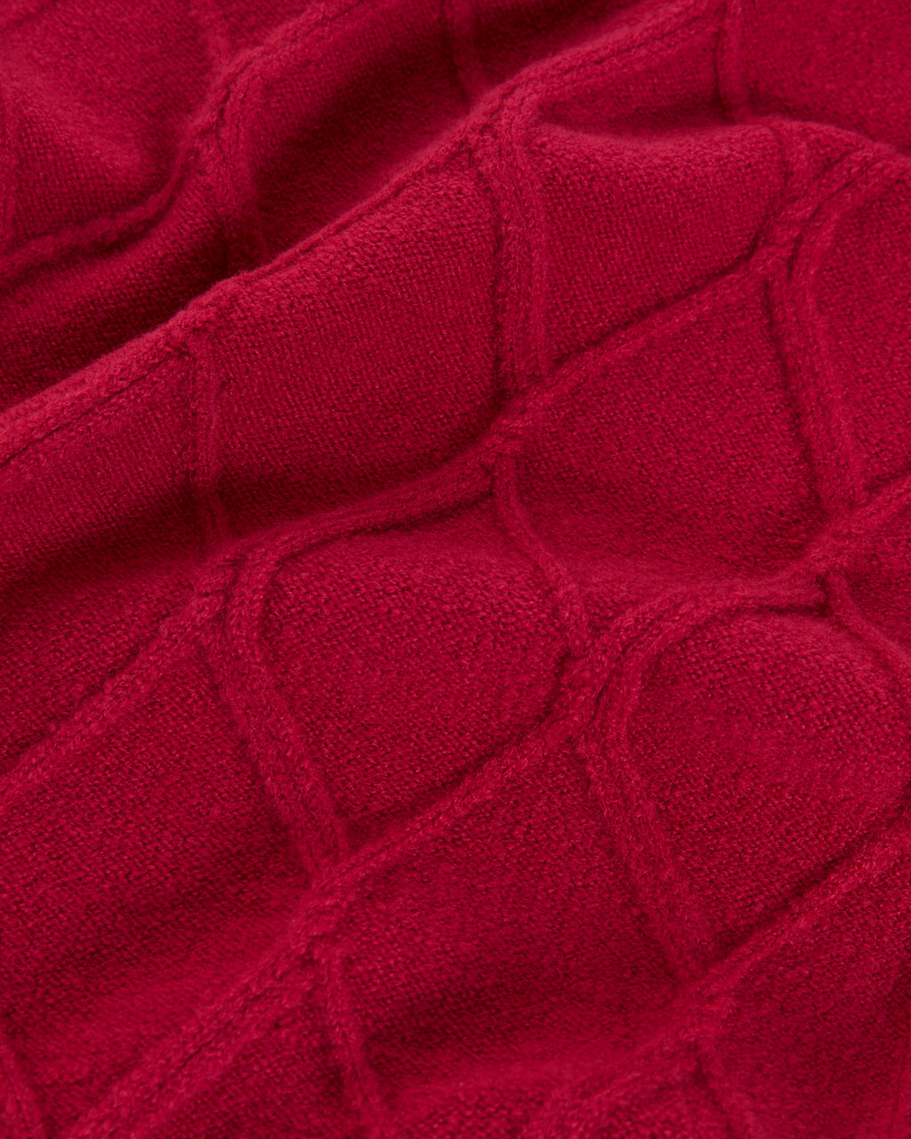 Knitted scarf with braided structure