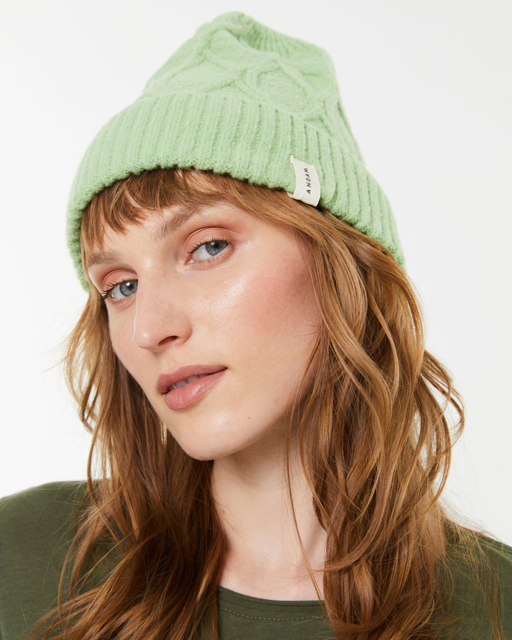 Women's knitted hat with braided structure