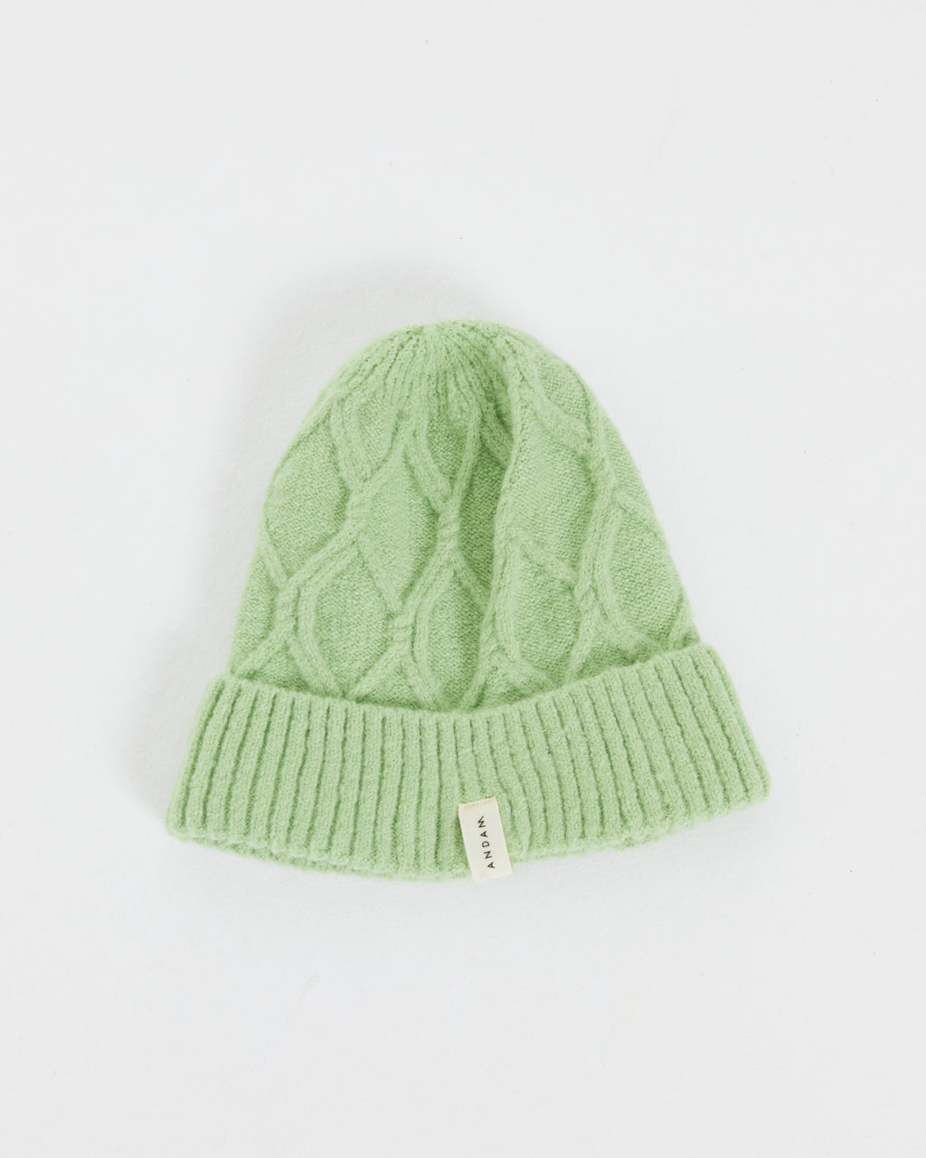 Women's knitted hat with braided structure