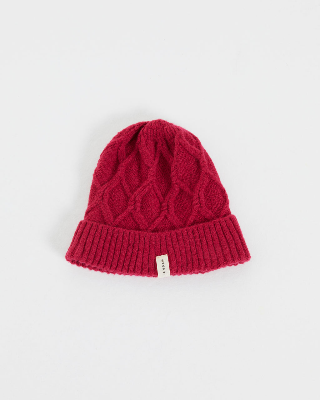 Women's knitted hat with braided structure